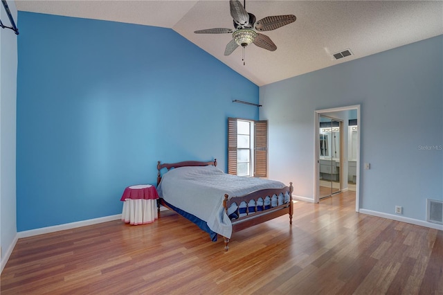 8521 Caitlin Ct, Hudson, FL 34667 - bedroom featuring wood finished floors, high vaulted ceiling, baseboards, and a ceiling fan