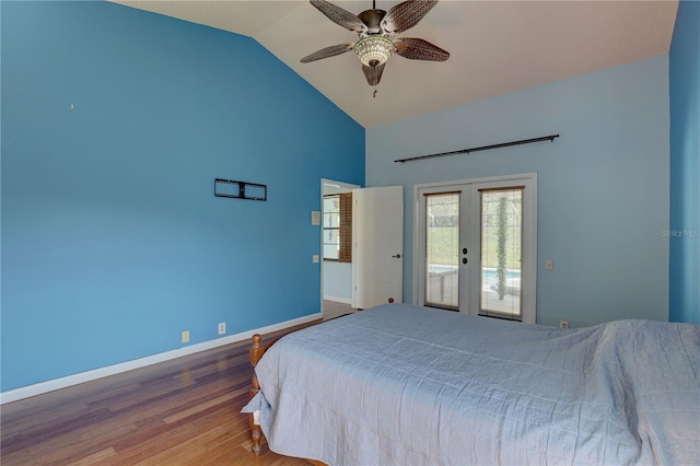 8521 Caitlin Ct, Hudson, FL 34667 - bedroom featuring french doors, access to outside, high vaulted ceiling, baseboards, and wood finished floors
