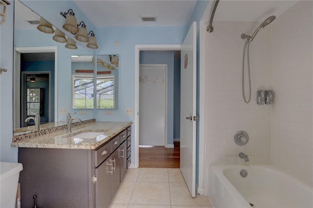 8521 Caitlin Ct, Hudson, FL 34667 - bathroom with vanity, tile patterned flooring, and shower / washtub combination
