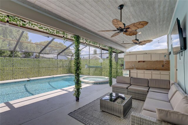 8521 Caitlin Ct, Hudson, FL 34667 - view of swimming pool featuring an outdoor living space, a patio area, a ceiling fan, a pool with connected hot tub, and a lanai