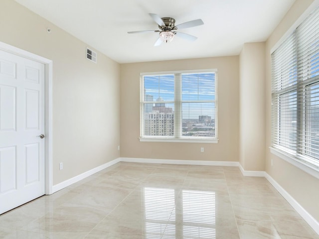 345 Bayshore Blvd Unit 1813, Tampa, FL 33606 - spare room featuring a ceiling fan, plenty of natural light, and light tile patterned floors