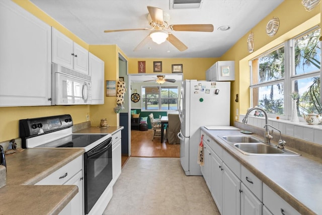 1226 S Telephone Point Rd, Inverness, FL 34450 - kitchen with white appliances, a sink, ceiling fan, plenty of natural light, and recessed lighting