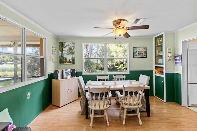 1226 S Telephone Point Rd, Inverness, FL 34450 - dining area with light wood finished floors and a ceiling fan
