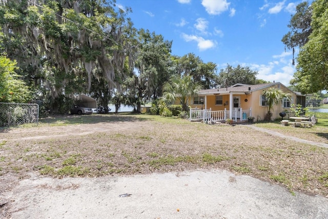 1226 S Telephone Point Rd, Inverness, FL 34450 - view of yard with a detached carport and a porch
