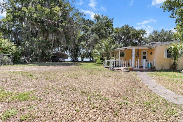 1226 S Telephone Point Rd, Inverness, FL 34450 - view of green lawn featuring a porch and a carport