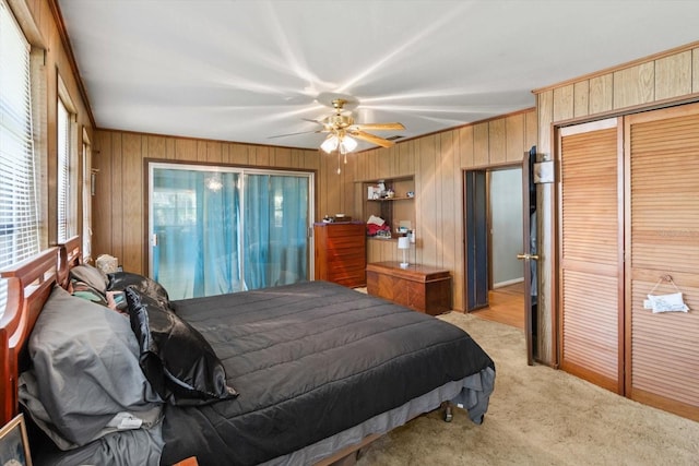 1226 S Telephone Point Rd, Inverness, FL 34450 - bedroom featuring wooden walls, light carpet, a ceiling fan, crown molding, and a closet