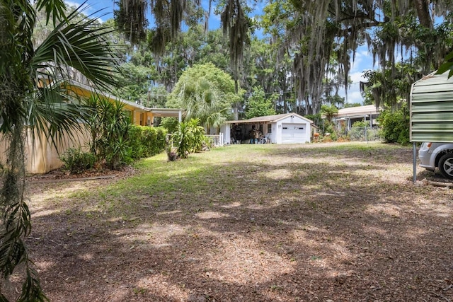 1226 S Telephone Point Rd, Inverness, FL 34450 - view of yard with a garage, a carport, and an outdoor structure