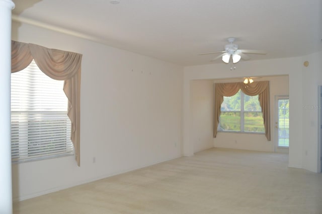 1922 Sassafras Dr, Wesley Chapel, FL 33543 - empty room with ceiling fan, a chandelier, and light carpet