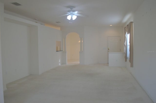 1922 Sassafras Dr, Wesley Chapel, FL 33543 - carpeted empty room featuring arched walkways and ceiling fan