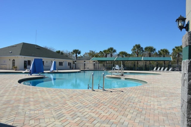 1922 Sassafras Dr, Wesley Chapel, FL 33543 - community pool featuring a patio area