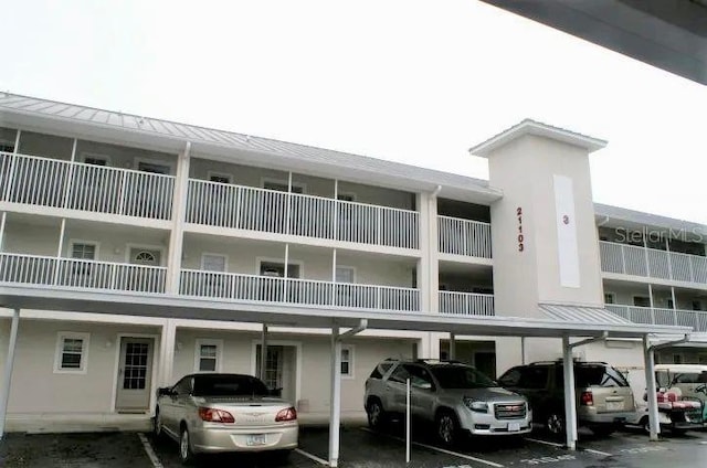 21103 Patio View Ct Unit 3302, Lutz, FL 33558 - view of property featuring covered parking
