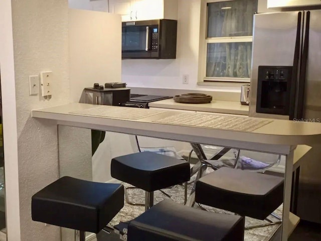 21103 Patio View Ct Unit 3302, Lutz, FL 33558 - kitchen featuring stainless steel appliances and a textured wall