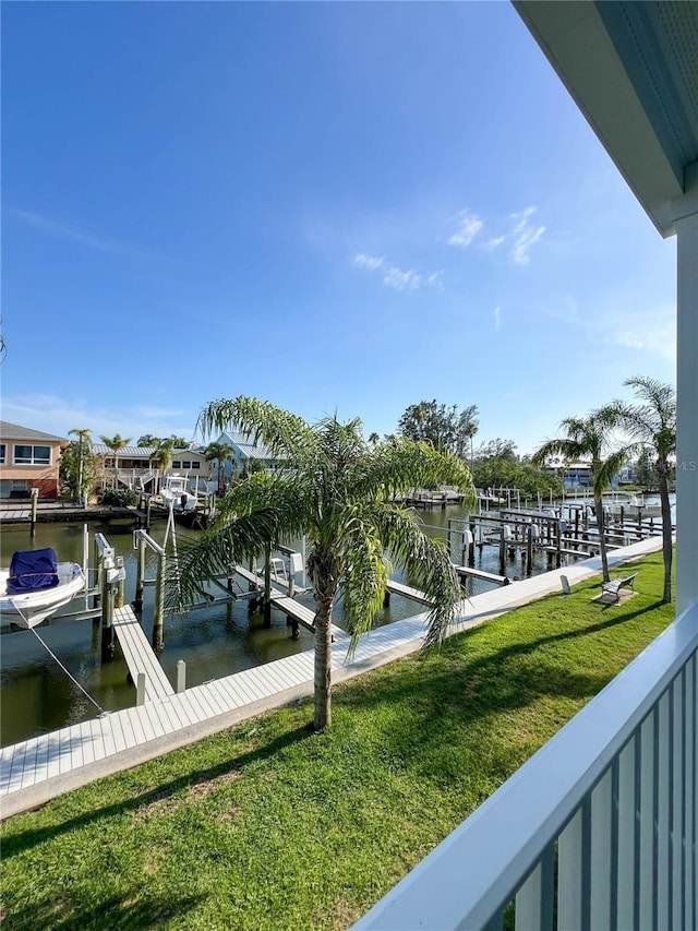 659 Garland Cir, Indian Rocks Beach, FL 33785 - dock area featuring a water view, a yard, and boat lift