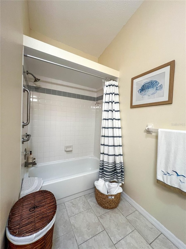659 Garland Cir, Indian Rocks Beach, FL 33785 - bathroom featuring shower / tub combo and baseboards