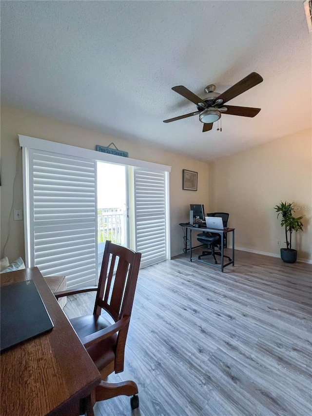 659 Garland Cir, Indian Rocks Beach, FL 33785 - office area with ceiling fan, wood finished floors, a textured ceiling, and baseboards