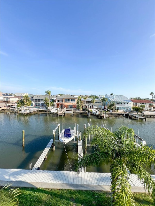 659 Garland Cir, Indian Rocks Beach, FL 33785 - dock featuring a water view, boat lift, and a residential view