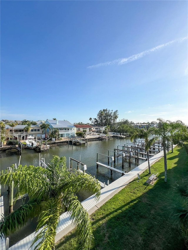 659 Garland Cir, Indian Rocks Beach, FL 33785 - dock area featuring a water view, a lawn, and boat lift