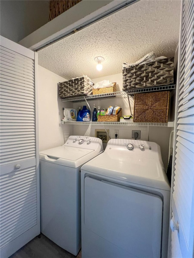659 Garland Cir, Indian Rocks Beach, FL 33785 - laundry room featuring separate washer and dryer and a textured ceiling