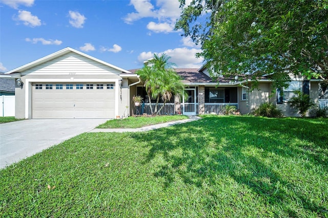 2507 Dewberry St, Valrico, FL 33596 - ranch-style home with a garage, a front lawn, concrete driveway, and a porch
