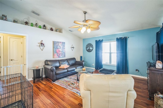 2507 Dewberry St, Valrico, FL 33596 - living room with a ceiling fan, vaulted ceiling, wood finished floors, and baseboards
