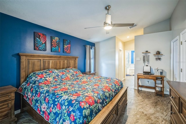 2507 Dewberry St, Valrico, FL 33596 - bedroom featuring vaulted ceiling, ceiling fan, connected bathroom, baseboards, and stone finish floors