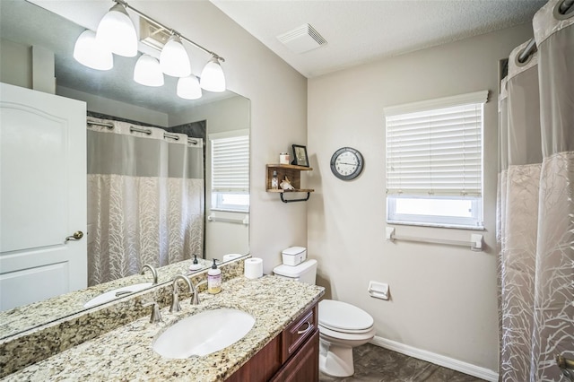 2507 Dewberry St, Valrico, FL 33596 - full bathroom featuring vanity, toilet, and baseboards