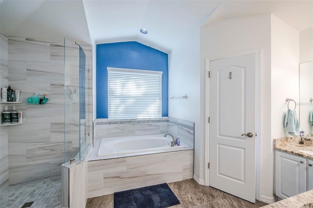 2507 Dewberry St, Valrico, FL 33596 - bathroom featuring vanity, a bath, a shower stall, and lofted ceiling