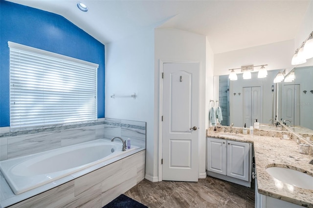 2507 Dewberry St, Valrico, FL 33596 - full bath with a bath, double vanity, vaulted ceiling, marble finish flooring, and a shower with door