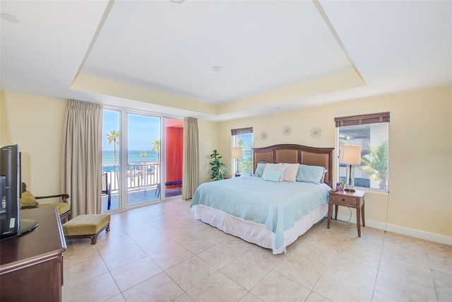301 S Gulfview Blvd Unit 301, Clearwater Beach, FL 33767 - bedroom with a tray ceiling, multiple windows, and access to exterior