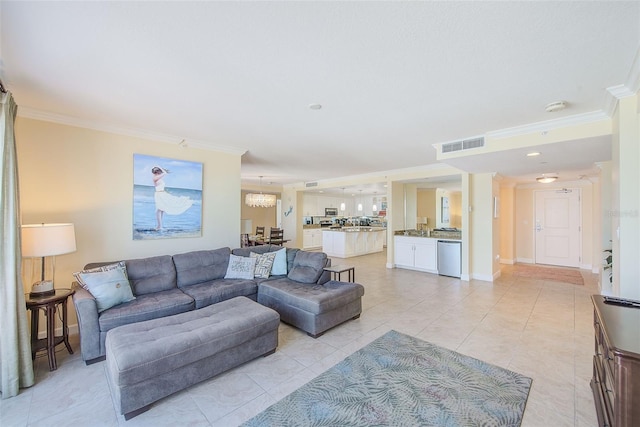 301 S Gulfview Blvd Unit 301, Clearwater Beach, FL 33767 - living area featuring ornamental molding, a chandelier, and light tile patterned floors