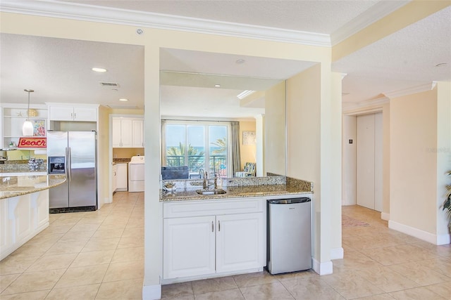 301 S Gulfview Blvd Unit 301, Clearwater Beach, FL 33767 - kitchen featuring stainless steel fridge, light tile patterned flooring, light stone counters, white cabinets, and ornamental molding