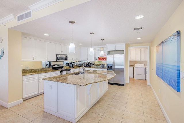 301 S Gulfview Blvd Unit 301, Clearwater Beach, FL 33767 - kitchen with stainless steel appliances, light tile patterned floors, white cabinets, and recessed lighting