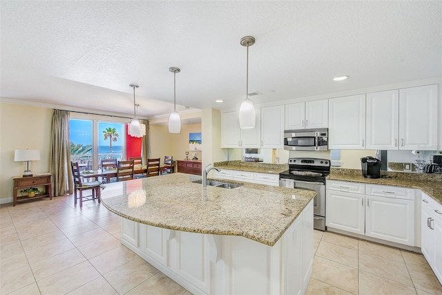 301 S Gulfview Blvd Unit 301, Clearwater Beach, FL 33767 - kitchen with appliances with stainless steel finishes, light tile patterned flooring, white cabinets, recessed lighting, and light stone countertops