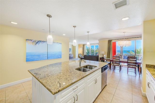 301 S Gulfview Blvd Unit 301, Clearwater Beach, FL 33767 - kitchen with dishwasher, a chandelier, white cabinetry, light tile patterned flooring, and recessed lighting