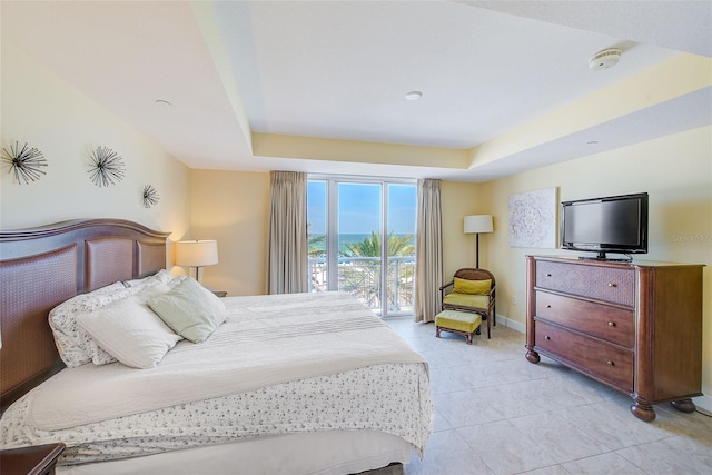 301 S Gulfview Blvd Unit 301, Clearwater Beach, FL 33767 - bedroom with light tile patterned flooring and a tray ceiling