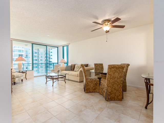 1520 Gulf Blvd Unit 1505, Clearwater Beach, FL 33767 - living area featuring a ceiling fan, a textured ceiling, light tile patterned floors, and floor to ceiling windows