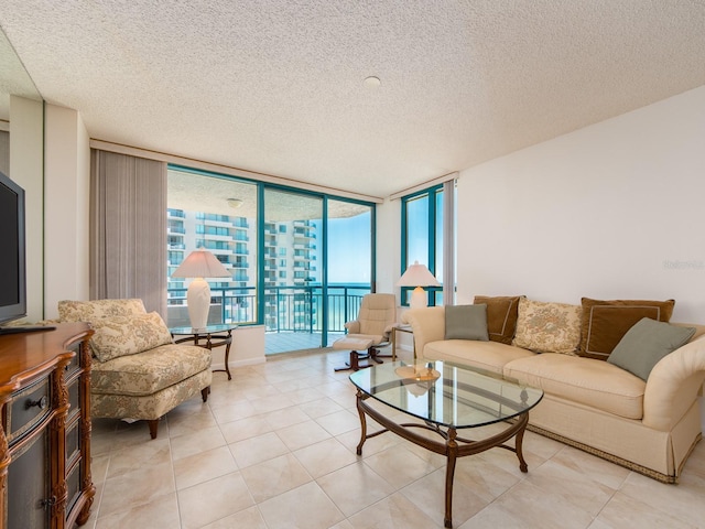 1520 Gulf Blvd Unit 1505, Clearwater Beach, FL 33767 - living area with a textured ceiling, expansive windows, and light tile patterned floors
