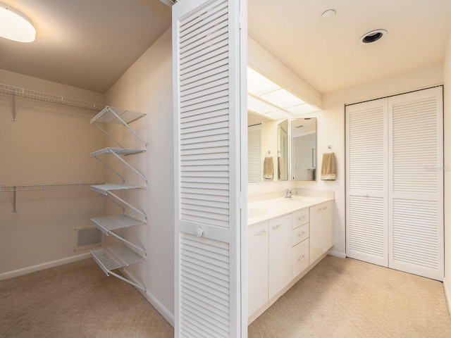 1520 Gulf Blvd Unit 1505, Clearwater Beach, FL 33767 - bathroom featuring a closet, vanity, baseboards, and carpet flooring