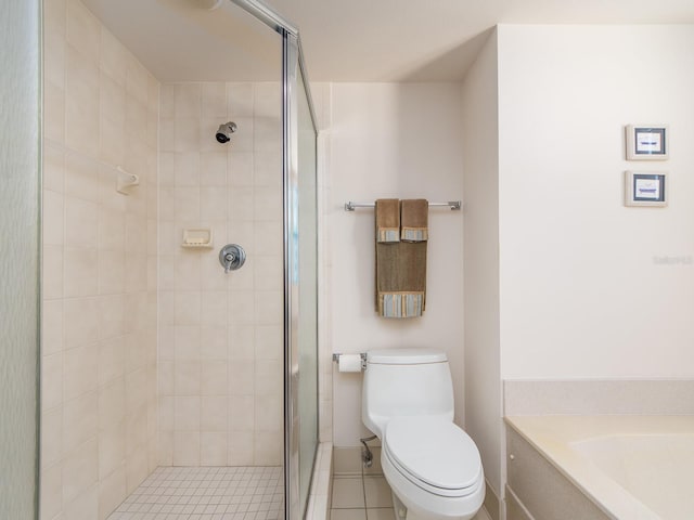 1520 Gulf Blvd Unit 1505, Clearwater Beach, FL 33767 - bathroom with a shower stall, toilet, tile patterned floors, a bath, and baseboards