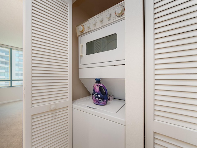 1520 Gulf Blvd Unit 1505, Clearwater Beach, FL 33767 - laundry area with stacked washer / dryer and carpet flooring