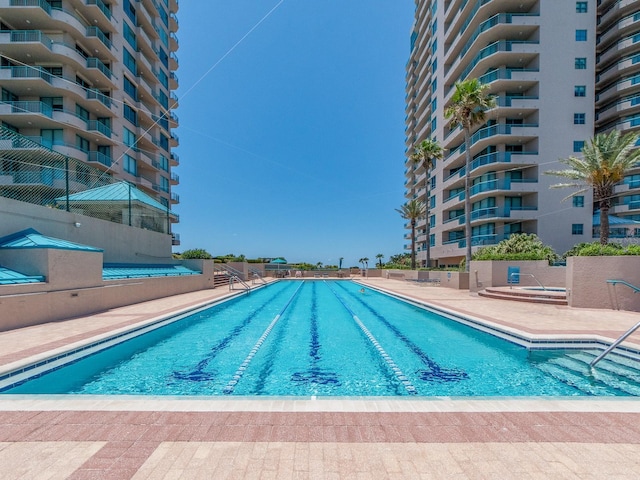 1520 Gulf Blvd Unit 1505, Clearwater Beach, FL 33767 - community pool featuring a patio area