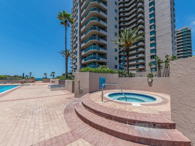 1520 Gulf Blvd Unit 1505, Clearwater Beach, FL 33767 - view of swimming pool with a hot tub