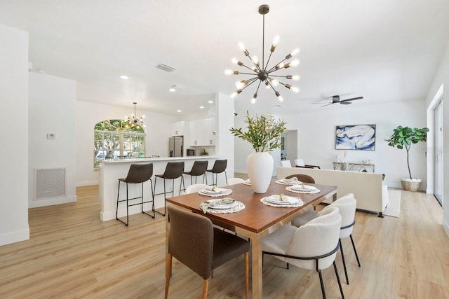 970 Ridgewood Ter, Tarpon Springs, FL 34689 - dining area featuring a chandelier, light wood-style flooring, baseboards, a ceiling fan, and recessed lighting