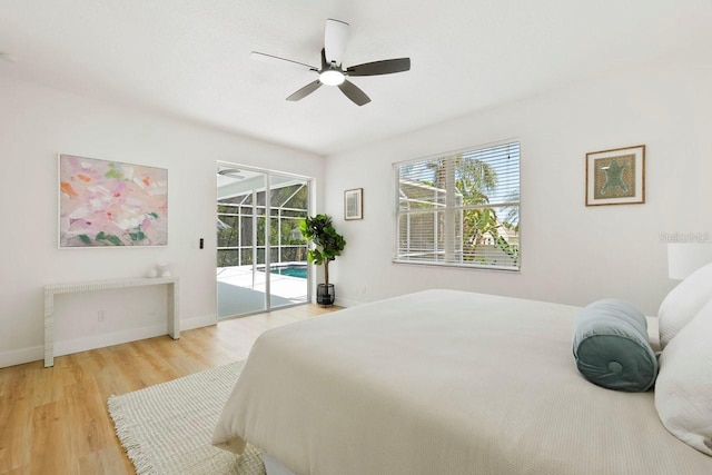 970 Ridgewood Ter, Tarpon Springs, FL 34689 - bedroom with access to outside, wood finished floors, baseboards, and ceiling fan