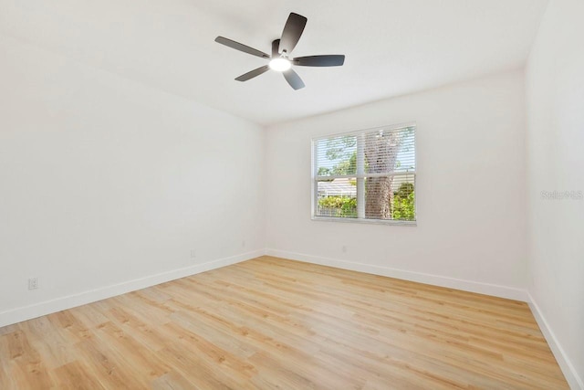 970 Ridgewood Ter, Tarpon Springs, FL 34689 - empty room featuring wood finished floors, baseboards, and ceiling fan