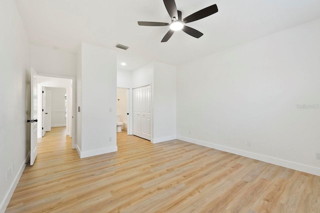 970 Ridgewood Ter, Tarpon Springs, FL 34689 - unfurnished bedroom with light wood-type flooring, baseboards, a closet, and recessed lighting