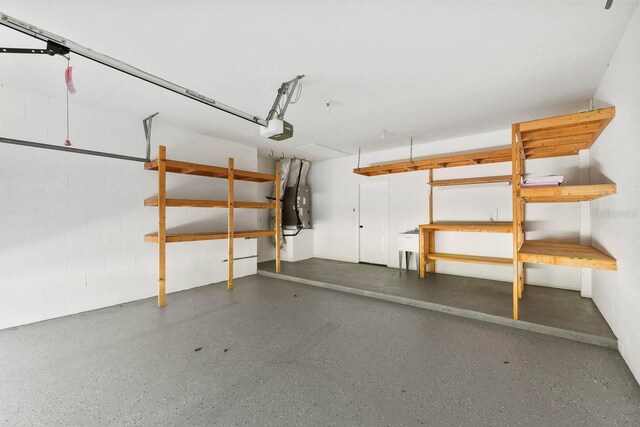 970 Ridgewood Ter, Tarpon Springs, FL 34689 - garage with a garage door opener and heating unit