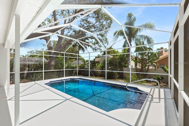 970 Ridgewood Ter, Tarpon Springs, FL 34689 - swimming pool featuring a patio area, a fenced backyard, and a lanai