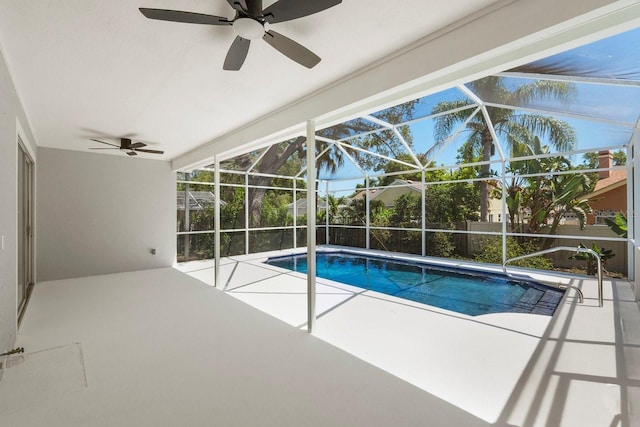 970 Ridgewood Ter, Tarpon Springs, FL 34689 - outdoor pool with a ceiling fan, a patio area, and glass enclosure