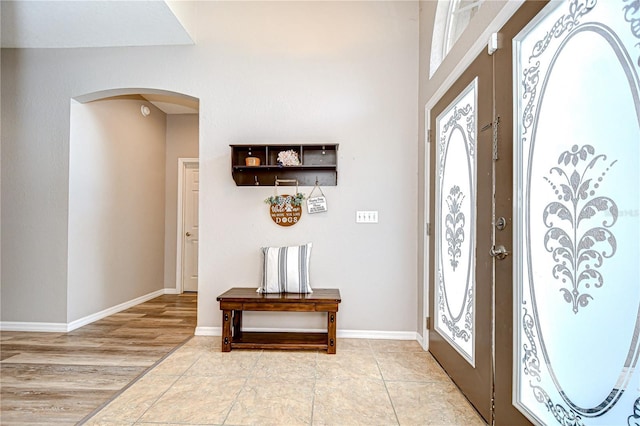 6519 Twin Bridges Dr, Zephyrhills, FL 33541 - foyer entrance with arched walkways, plenty of natural light, and baseboards